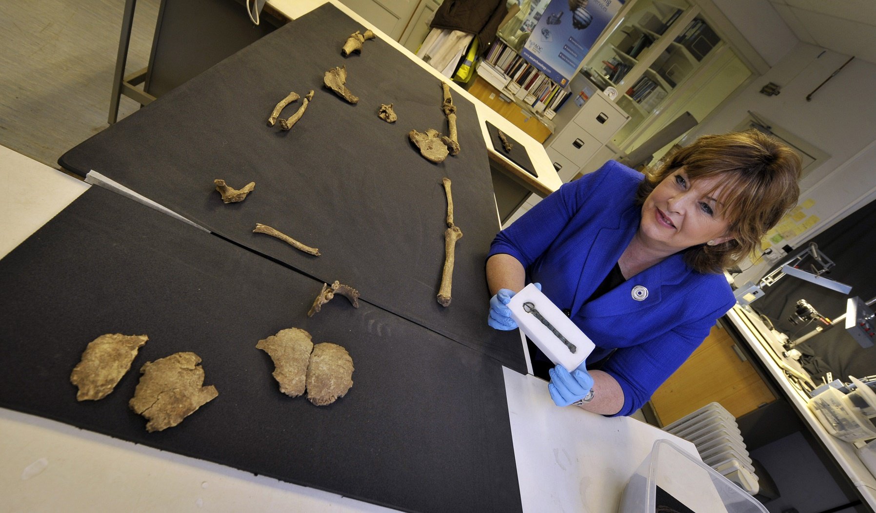 Fiona Hyslop (Cabinet Secretary for Culture and External Affairs) viewing a tenth-century belt buckle which was discovered on an archaeological dig at Auldhame (East Lothian). The belt was found with a skeleton which may be that of Olaf Guthfrithsson. Credit : Historic Scotland