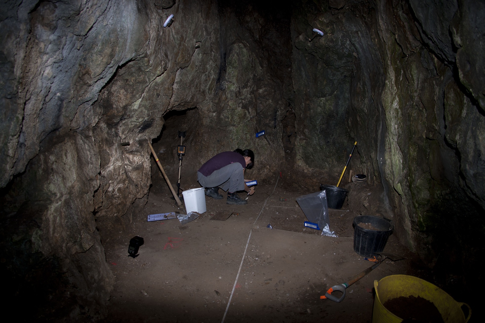Excavating at back of Reynards Kitchen Cave © National Trust : D Slade