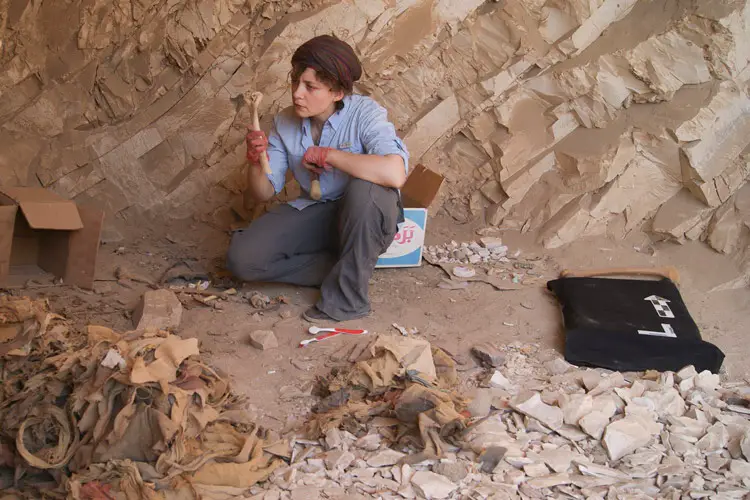 Stanford postdoctoral scholar Anne Austin examines the skeletal remains of ancient Egyptians found in the burial sites of Deir el-Medina. (Photo courtesy of Anne Austin) 