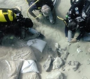 Dr Benjamin (left) and the Haifa University team clear away mobile sands covering the excavation site. Photo by J. McCarthy.